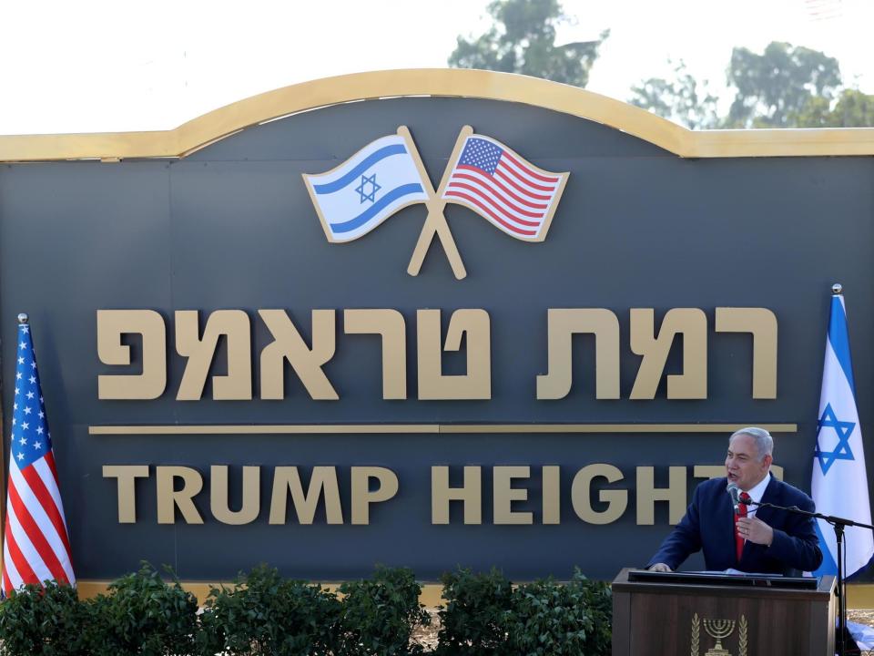 Israeli prime minister Benjamin Netanyahu has inaugurated a settlement named after US President Donald Trump in the occupied territory of the Golan Heights.On Sunday, Mr Netanyahu’s cabinet convened in Bruchim, a hamlet of 10 people, to rebrand it as “Ramat Trump”, Hebrew for “Trump Heights”, in a gesture of appreciation for American pro-Israel policies in the region.“It's absolutely beautiful,” said US Ambassador David Friedman, who attended the ceremony. Noting that Trump celebrated his birthday on Friday, he said: “I can't think of a more appropriate and a more beautiful birthday present.” Addressing the ceremony, Mr Netanyahu called Mr Trump a “great friend” of Israel and described the Golan, which overlooks northern Israel, as an important strategic asset.“The Golan Heights was and will always be an inseparable part of our country and homeland,” he said. But most of the international community disputes that claim. Israel captured the Golan Heights from Syria in the 1967 Mideast war and annexed it in 1981 – a move deemed illegal under international law. In March, the US became the first country to recognise Israel’s sovereignty over the Golan Heights, breaking with decades of US policy and international agreements that consider the territory occupied.The move was seen as both a nod to his conservative Christian supporters, as well as a boost to Israeli prime minister, Benjamin Netanyahu. Mr Netanyahu is running for re-election in September after narrowly winning a majority but failing to form a governing coalition in April.“Few things are more important to the security of the state of Israel than permanent sovereignty over the Golan Heights,” said Mr Friedman, the ambassador. “It is simply obvious, it is indisputable and beyond any reasonable debate.” The decision, the latest in a series of diplomatic moves benefiting Israel, was widely applauded in Israel. Syria has demanded a return of the strategic territory, which overlooks northern Israel, as part of any peace deal. On Sunday, Mr Netanyahu and Mr Friedman unveiled a sign trimmed in gold with the name “Trump Heights” and the Israeli and US flags.Rosa Zhernakov, a resident of Bruchim since 1991, said the community was excited by Sunday's decision. “We hope it will benefit the Golan Heights,” she said, standing outside her bungalow on one of Bruchim’s few streets. She said the revitalization of the settlement will mean “more security” for residents from any possible return of the Golan Heights to Syria as part of a future peace treaty.Vladimir Belotserkovsky, 75, another veteran resident, said he welcomed any move to build up the settlement. “We certainly thank, and I personally, am satisfied by the fact that they're founding the new settlement named for Trump,” he said.But critics called the move a cheap PR stunt. Developing Ramat Trump requires overcoming several bureaucratic obstacles, and with Mr Netanyahu’s re-election uncertain, it’s unclear whether he will complete the task.“There’s no funding, no planning, no location, and there’s no real binding decision,” said Zvi Hauser, an opposition lawmaker who formerly served as Mr Netanyahu's cabinet secretary. One of the obstacles is the Golan’s remote location. While Israel has encouraged and promoted settlement there, it lies several hours from the economic centre of Tel Aviv. The area is home to small agriculture and tourism sectors but otherwise has little industry. According to Israeli figures, almost 50,000 people live in the Golan, including about 22,000 Jewish Israelis and nearly 25,000 Arab Druze residents. Additional reporting by AP