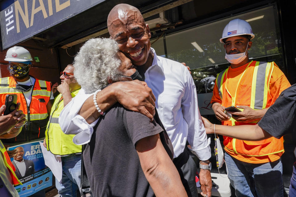 Democratic mayoral candidate Eric Adams hugs a supporter after a campaign event, Thursday, June 17, 2021, in the Harlem neighborhood of New York. (Mary Altaffer/AP)