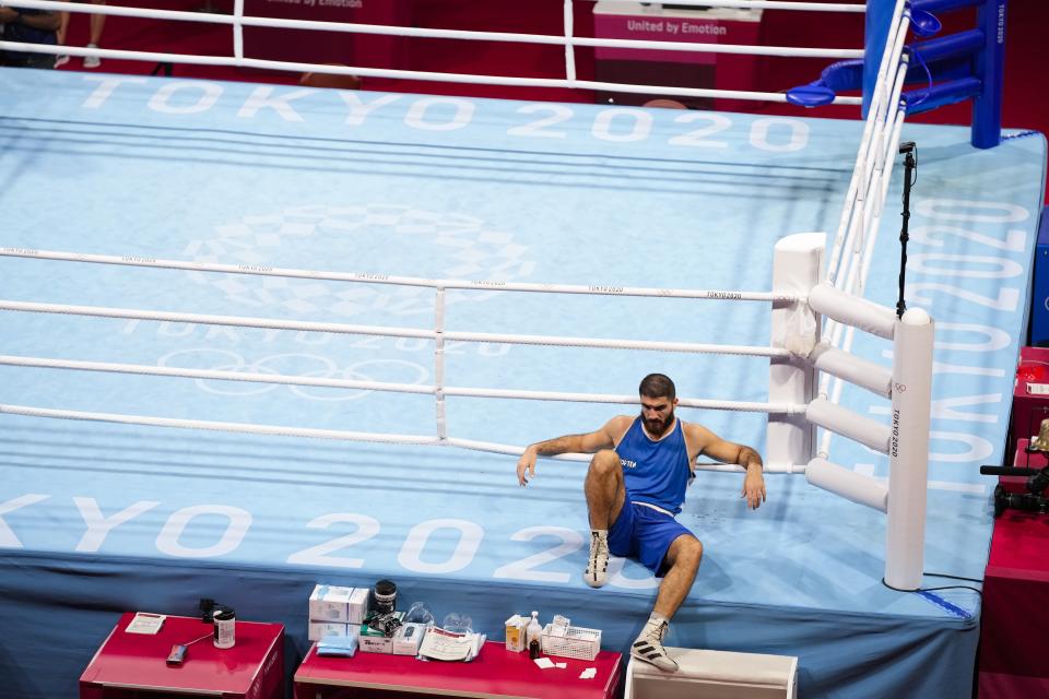 Eliad Mourad, of France refuses to leave the ring after losing a men's super heavyweight over 91-kg boxing match against Britain's Frazer Clarke at the 2020 Summer Olympics, Sunday, Aug. 1, 2021, in Tokyo, Japan. (AP Photo/Frank Franklin II)