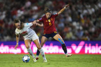 Switzerland's Lia Wälti, left, and Spain's Aitana Bonmatí fight for the ball during the women's Nations League group D soccer match between Spain and Switzerland at the Nuevo Arcangel stadium in Cordoba, Spain, Tuesday, Sept. 26, 2023. (AP Photo/Jose Breton)