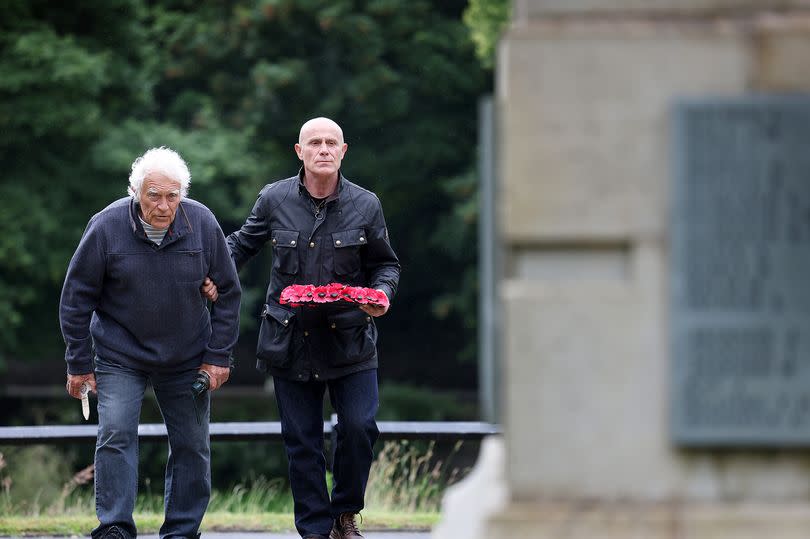 Harod Lord Jnr, left, with his son, Julian -Credit:Sean Hansford | Manchester Evening News