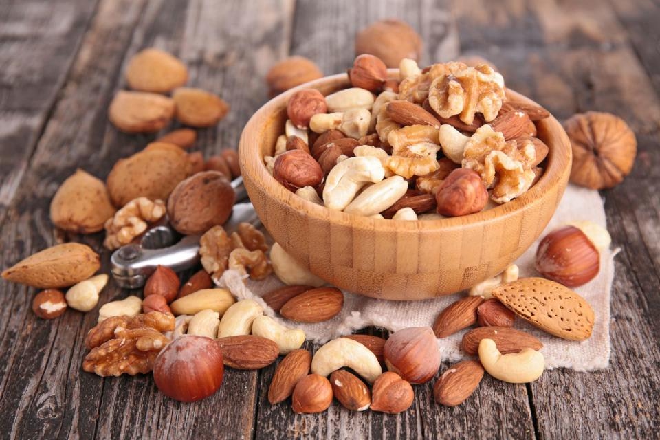 <p>In a nutshell: USDA researchers say that eating 1.5 ounces of tree nuts daily can reduce your risk of heart disease and diabetes. Walnuts are rich in omega-3s, while hazelnuts contain arginine, an amino acid that may lower blood pressure. An ounce of almonds has as many heart-healthy polyphenols as a cup of green tea. The key is moderation since nuts are high in calories. Keep a jar of chopped nuts in your fridge, and sprinkle a tablespoon on cereal, salads, stir-fries, or yogurt. </p><p><strong>Try it: </strong><a href="https://www.prevention.com/food-nutrition/recipes/a20495124/tailgate-party-nut-mix/" rel="nofollow noopener" target="_blank" data-ylk="slk:Tailgate Party Nut Mix;elm:context_link;itc:0;sec:content-canvas" class="link ">Tailgate Party Nut Mix</a></p>