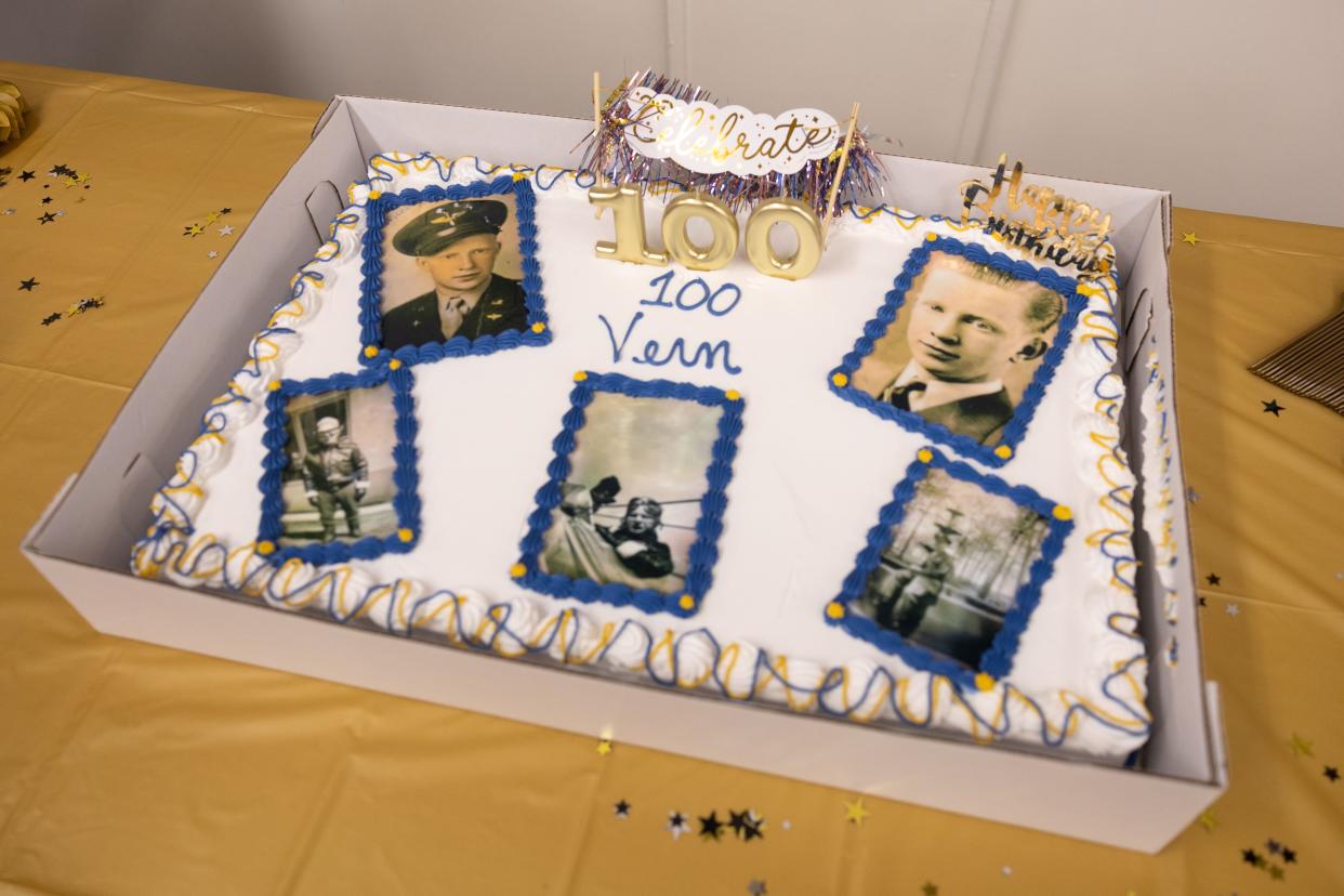 A birthday cake at a 100th birthday event showcases photos of young Vernon Roen on Saturday, Feb. 10, 2024, at the Ravenna VFW.