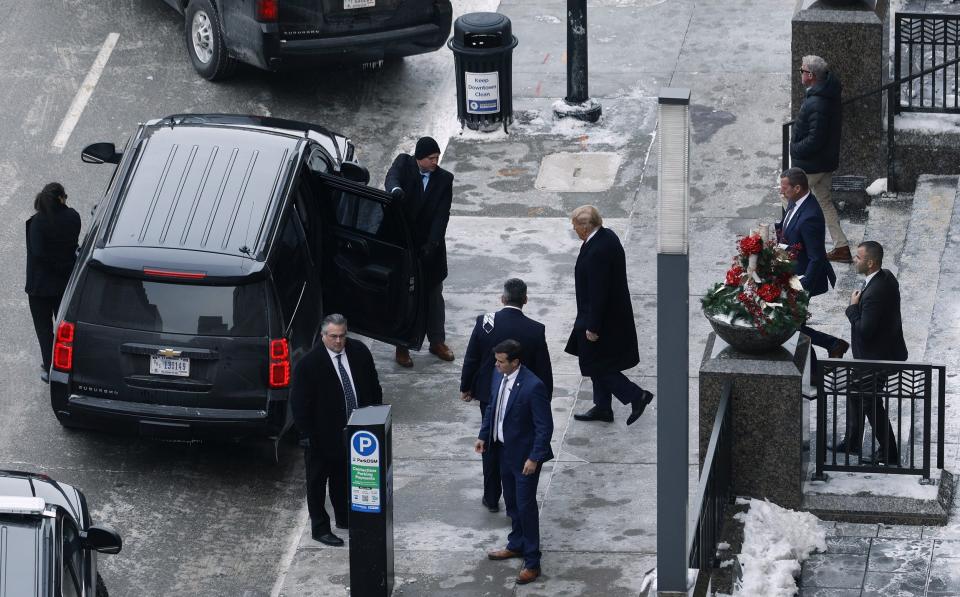 Donald Trump leaves a meeting with campaign advisors in Iowa