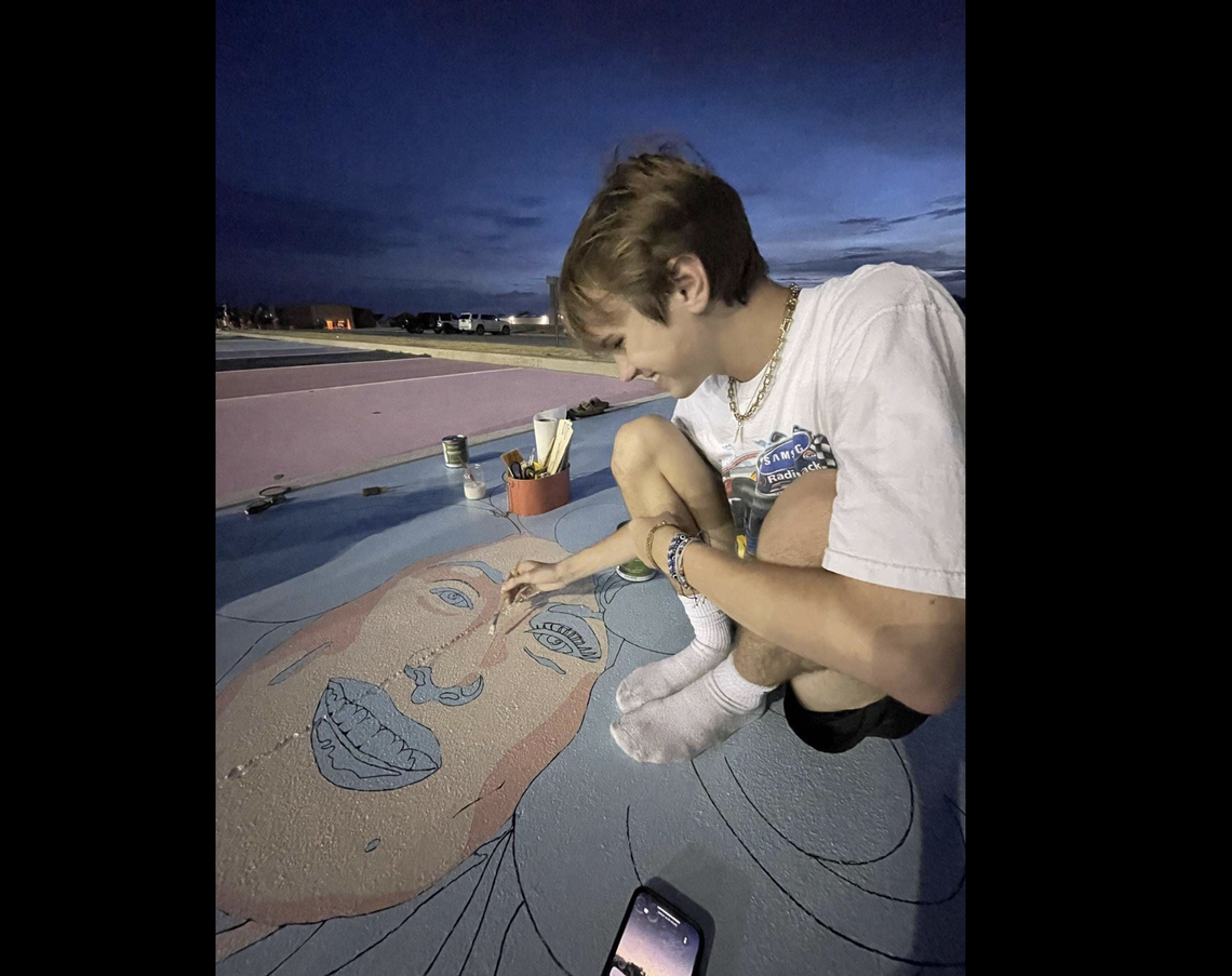 Will Lepard spent hours creating a painting of his idol, Dolly Parton, at Aledo High School for his senior parking spot.