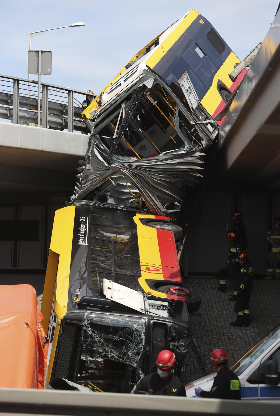 The wreckage of a Warsaw city bus is shown after the articulated bus crashed off an overpass, killing one person and injuring about 20 people, in Warsaw, Poland, on June 25, 2020. The accident forced Warsaw Mayor Rafal Trzaskowski, who is a runner-up candidate in Sunday presidential election, to suspend his campaigning.(AP Photo/Czarek Sokolowski)