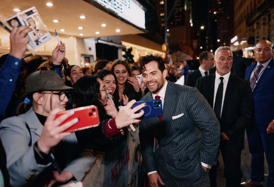 Henry Cavill (center) greets fans at the New York City world premiere of "Enola Holmes 2."