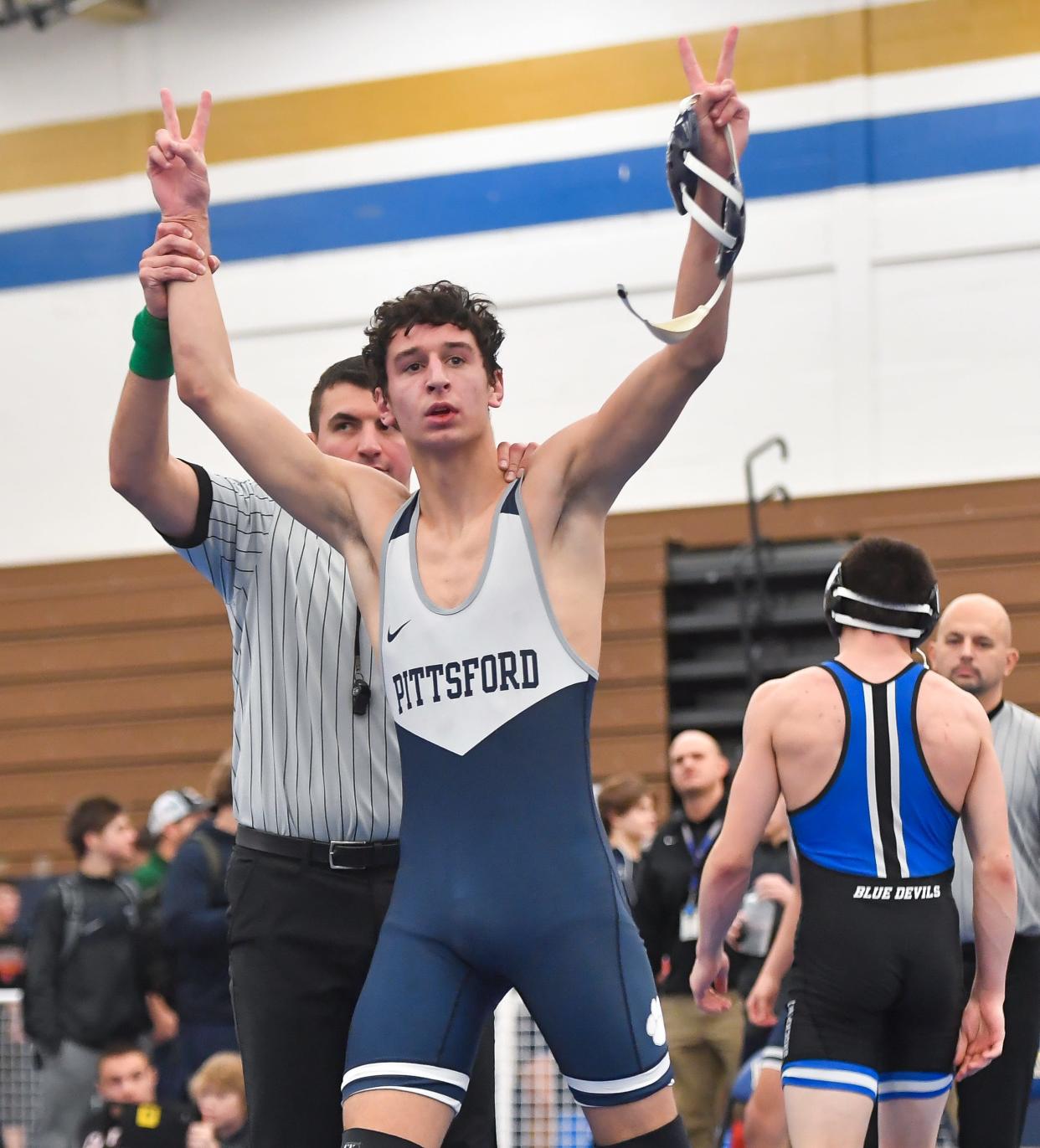 Pittsford’s Zach Gerby celebrates his win over Brockport’s Paul Rose in the final of the 152-pound weight class during the Monroe County Wrestling Championships, Saturday, Dec. 16, 2023.