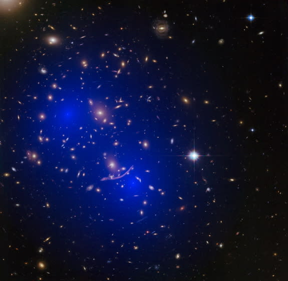 An image of galaxy merger A370, overlaid with a model of the dark matter present. Scientists have used galaxy mergers to narrow down the possible makeup of dark matter.