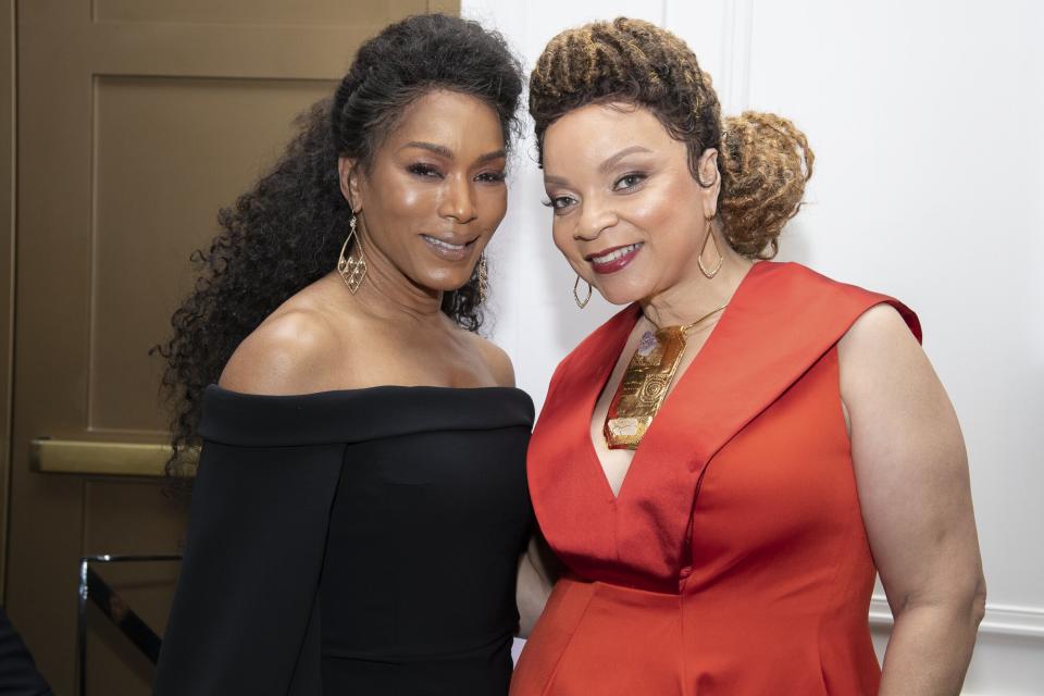 Angela Bassett and Ruth E. Carter pose for a photo at the ICON MANN Power 150 Dinner at Waldorf Astoria Beverly Hills on February 21, 2019 in Beverly Hills, California.
