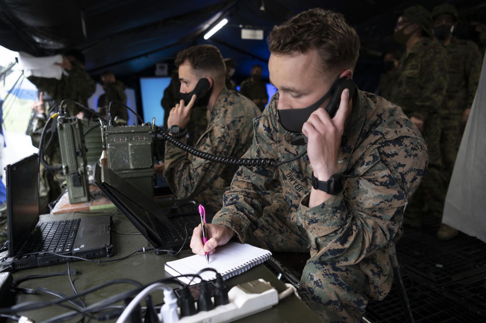 U.S. Marines soldiers take part in a joint military drill between Japan Self-Defense Force, French army and U.S. Marines, at the Kirishima exercise area in Ebino, Miyazaki prefecture, southern Japan Saturday, May 15, 2021. (Charly Triballeau/Pool Photo via AP)