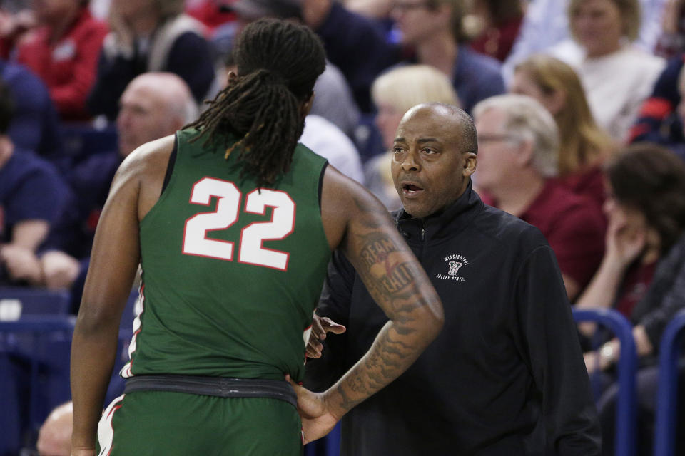 Mississippi Valley State head coach George Ivory, right, speaks with forward Reginald Reynolds (22) during the first half of an NCAA college basketball game against Gonzaga, Monday, Dec. 11, 2023, in Spokane, Wash. (AP Photo/Young Kwak)