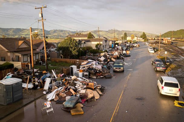 PHOTO: Belongings and other household items can be seen in piles outside of home impacted by flooding in Pajaro, Calif. on March 28, 2023. (Bronte Wittpenn/San Francisco Chronicle via Polaris)