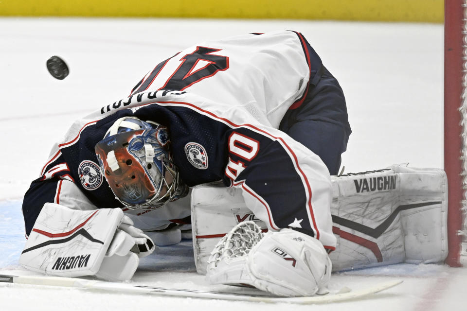 The puck sails over Columbus Blue Jackets goaltender Daniil Tarasov (40) for a goal by Anaheim Ducks center Mason McTavish (not pictured) during the second period of an NHL hockey game in Anaheim, Calif., Wednesday, Feb. 21, 2024. Tarasov left the ice after the goal was scored. (AP Photo/Alex Gallardo)