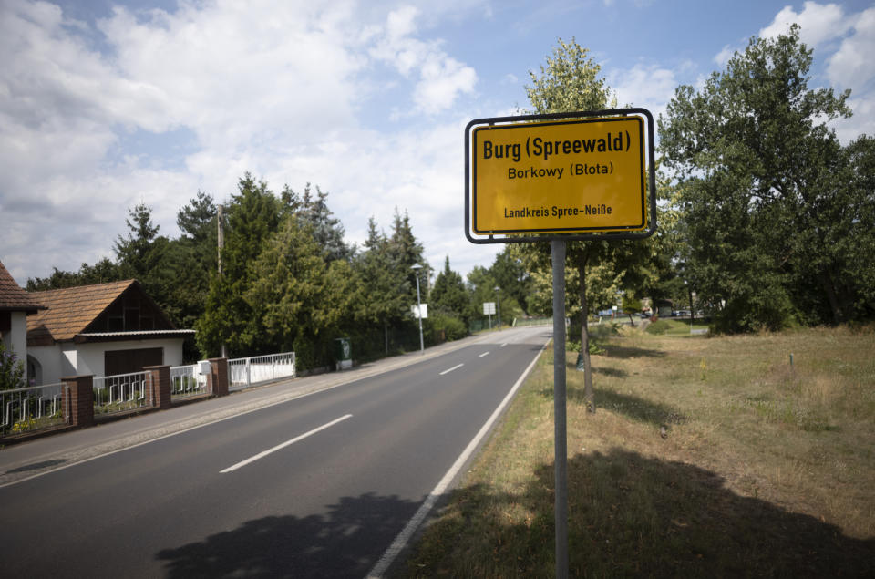 The city sign stands beside the road in Burg (Spreewald), Germany, Wednesday, July 19, 2023. Two teachers in eastern Germany tried to counter the far-right activities of students at their small town high school. Disheartened by what they say was a lack of support from fellow educators, Laura Nickel and Max Teske decided to leave Mina Witkojc School in Burg. (AP Photo/Markus Schreiber)