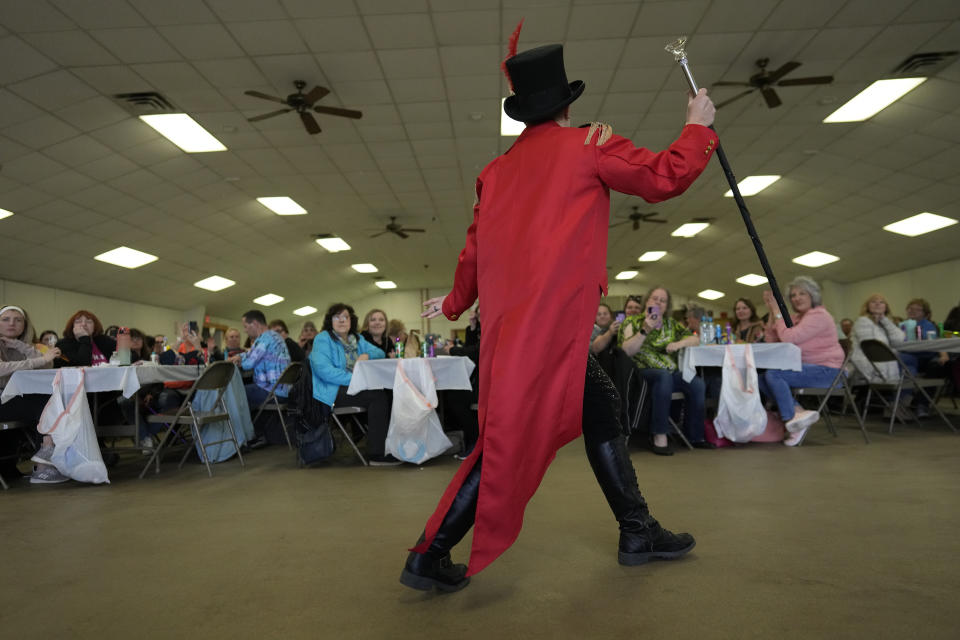 Drag king Xander Valentine, aka Gwen Bobbie, performs "The Greatest Show" from the movie "The Greatest Showman" for the sold-out "Drag Bingo" fundraiser at the Nescopeck Township Volunteer Fire Company Social Hall, in Nescopeck, Pa., Saturday, March 18, 2023, to raise money for a new roof for the Berwick Theater and Center for Community Arts, in Berwick, Pa. (AP Photo/Carolyn Kaster)