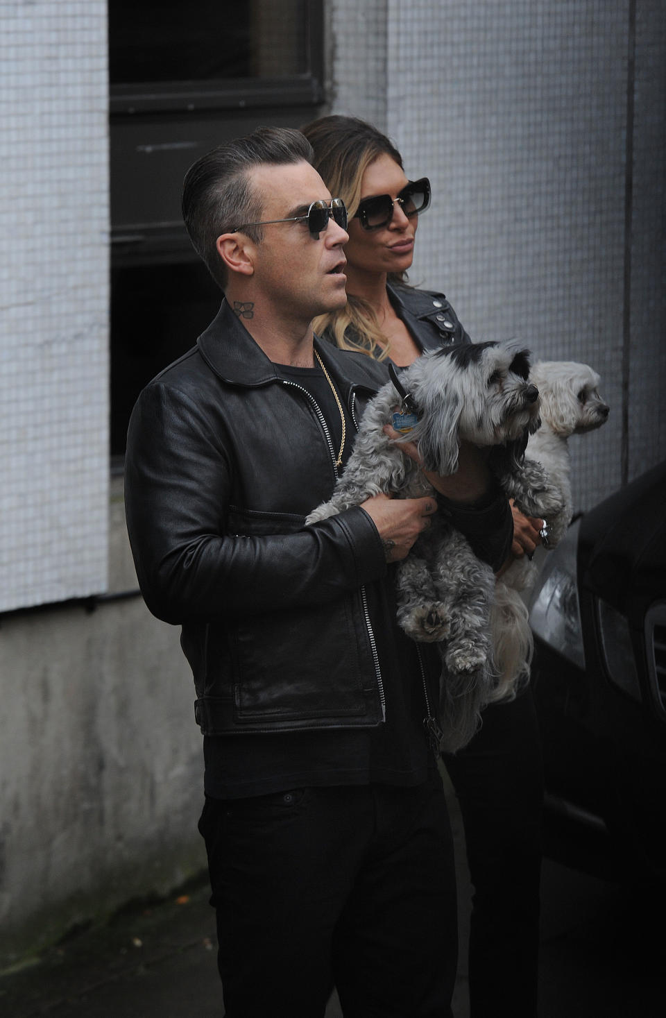 Robbie Williams and his wife Ayda Field, talk to waiting fans after appearing on ITV's Loose Women show.