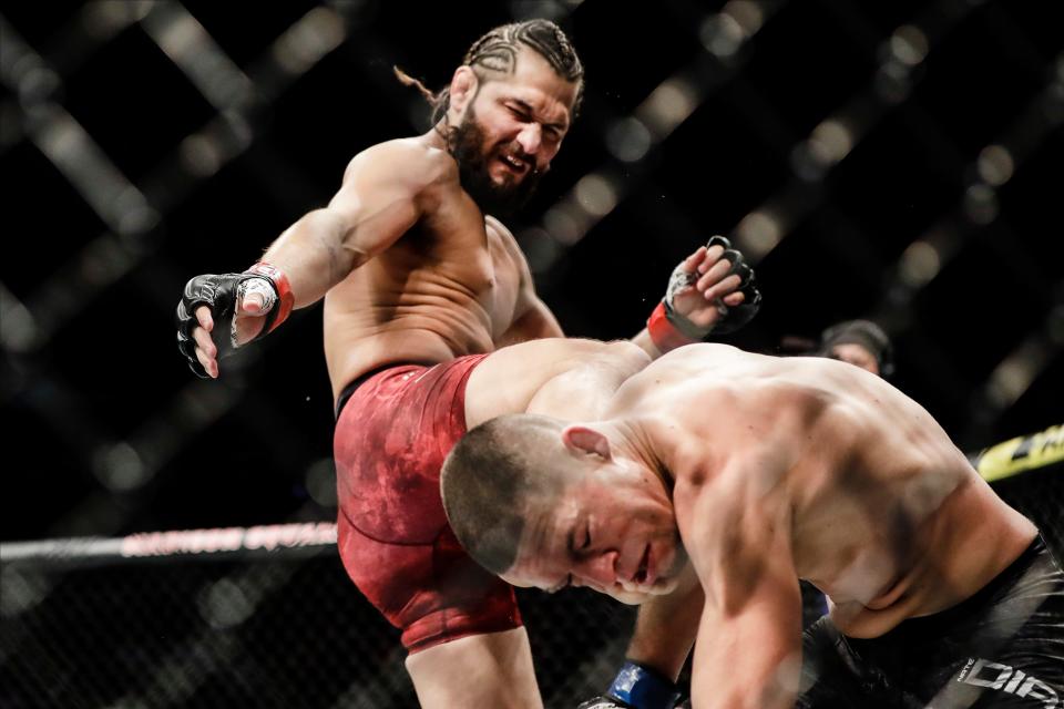 Jorge Masvidal, left, kicks Nate Diaz during the first round of a welterweight mixed martial arts bout at UFC 244 early Sunday, Nov. 3, 2019 in New York.