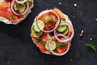 <p>Though you can almost always find scallion cream cheese, we included a mini recipe that adds extra herbaceous-ness thanks to fresh <a href="https://www.delish.com/cooking/recipe-ideas/g40459134/dill-recipes/" rel="nofollow noopener" target="_blank" data-ylk="slk:dill;elm:context_link;itc:0;sec:content-canvas" class="link ">dill</a>, which we all know pairs <em>beautifully</em> with salmon. Top these <a href="https://www.delish.com/cooking/recipe-ideas/a33446892/lox-recipe/" rel="nofollow noopener" target="_blank" data-ylk="slk:lox;elm:context_link;itc:0;sec:content-canvas" class="link ">lox</a>-y with whatever you like—we're partial to red onion, <a href="https://www.delish.com/cooking/g1172/cucumber-recipes/" rel="nofollow noopener" target="_blank" data-ylk="slk:cucumbers;elm:context_link;itc:0;sec:content-canvas" class="link ">cucumbers</a>, and capers, but you do you.<br><br>Get the <strong><a href="https://www.delish.com/cooking/recipe-ideas/a39456710/bagel-and-lox-recipe/" rel="nofollow noopener" target="_blank" data-ylk="slk:Bagel and Lox recipe;elm:context_link;itc:0;sec:content-canvas" class="link ">Bagel and Lox recipe</a></strong>.</p>