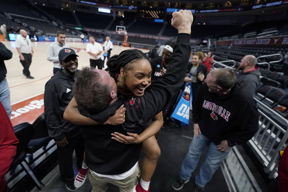 Louisville guard Chrislyn Carr, center, celebrates with fans after the team's win over Texas in a second-round college basketball game in the NCAA Tournament in Austin, Texas, Monday, March 20, 2023. (AP Photo/Eric Gay)