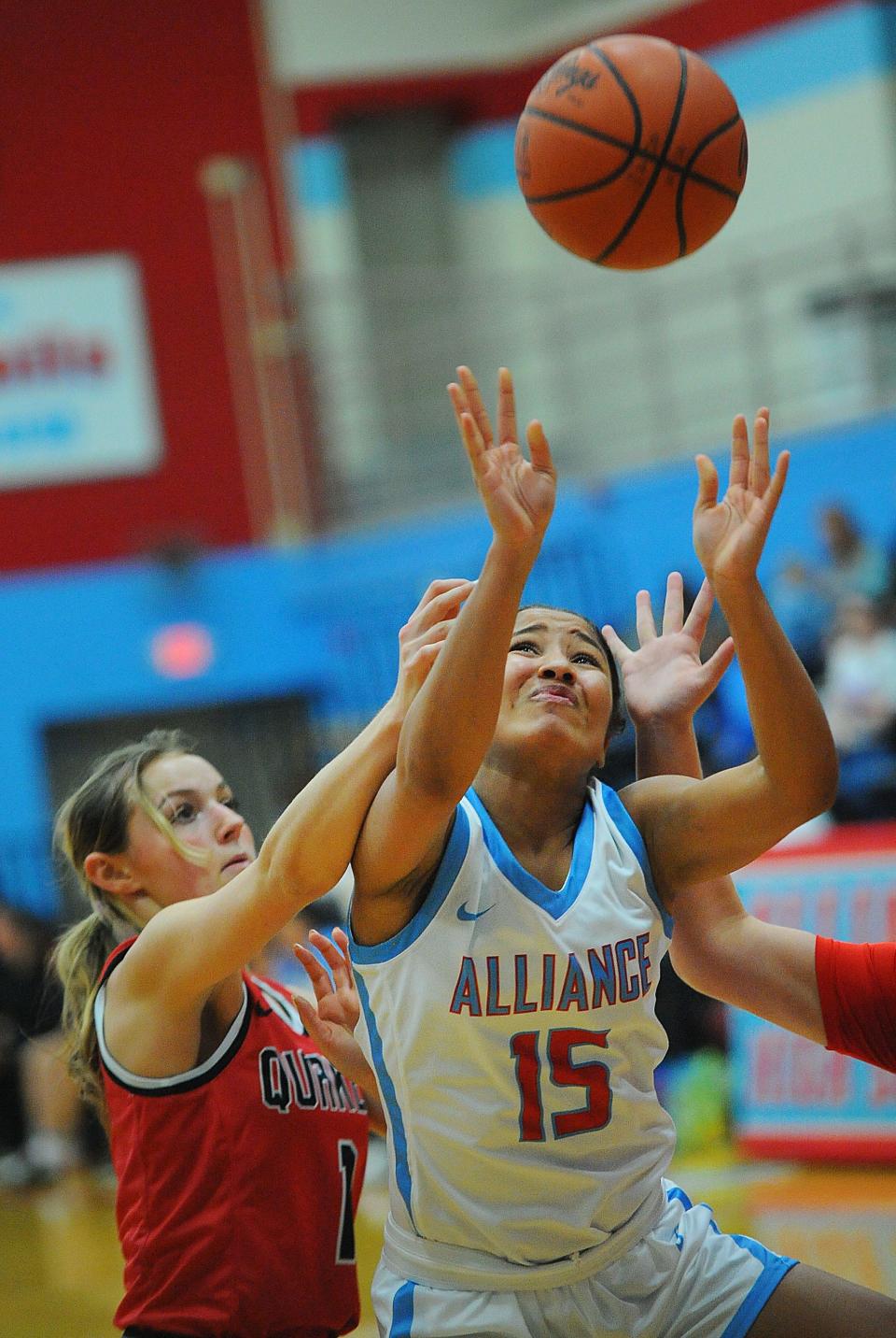 Alliance's Jayla Callock is fouled by Salem's Zoie Reid during an Eastern Buckeye Conference game at Alliance High School Wednesday, November 30, 2022.