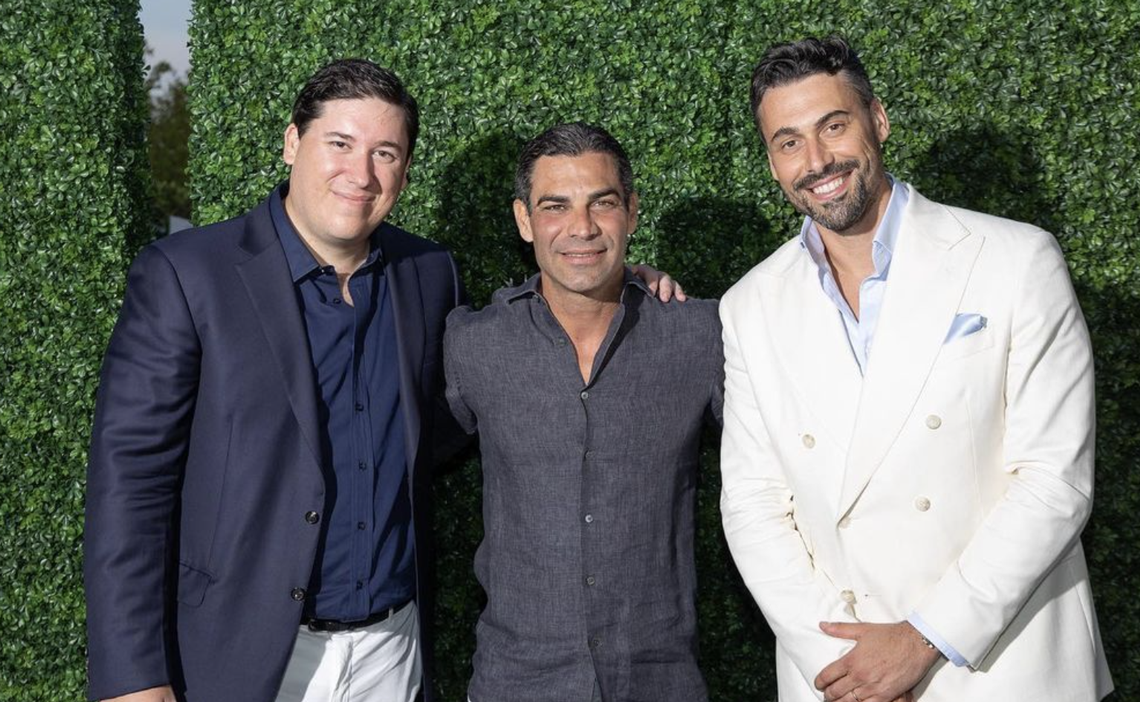 During the $6,000-per-person pop-up Once Upon a Kitchen, event coordinators Barnabas Carrega (left) and Luca Pavanelli (right) from hospitality group Gr8 Experience pose with Miami Mayor Francis Suarez (center).