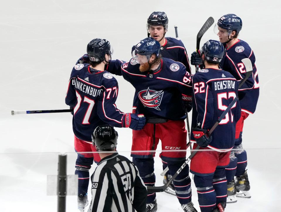 Blue Jackets defenseman Nick Blankenburg (77) and center Cole Sillinger (34) are battling for roster spots.