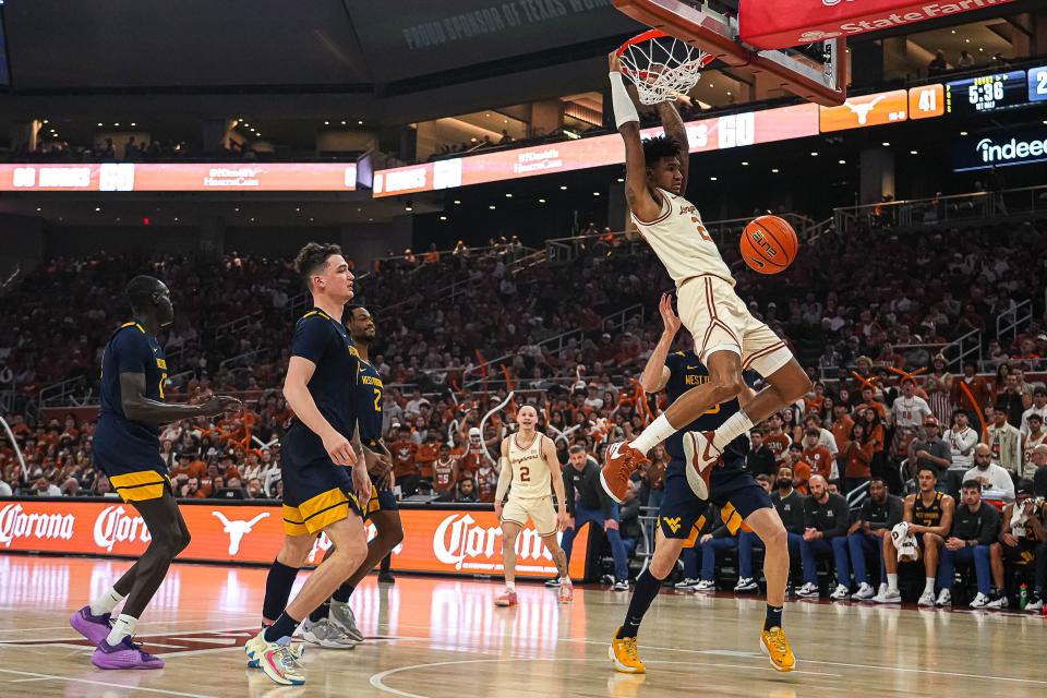 Texas forward Dillon Mitchell dunks the ball during Saturday's 94-58 win over West Virginia, an important victory that moved the Longhorns closer to a possible NCAA Tournament appearance.