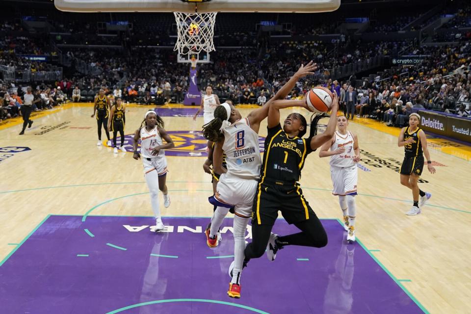 Sparks center Zia Cooke shoots against Phoenix Mercury Moriah Jefferson.