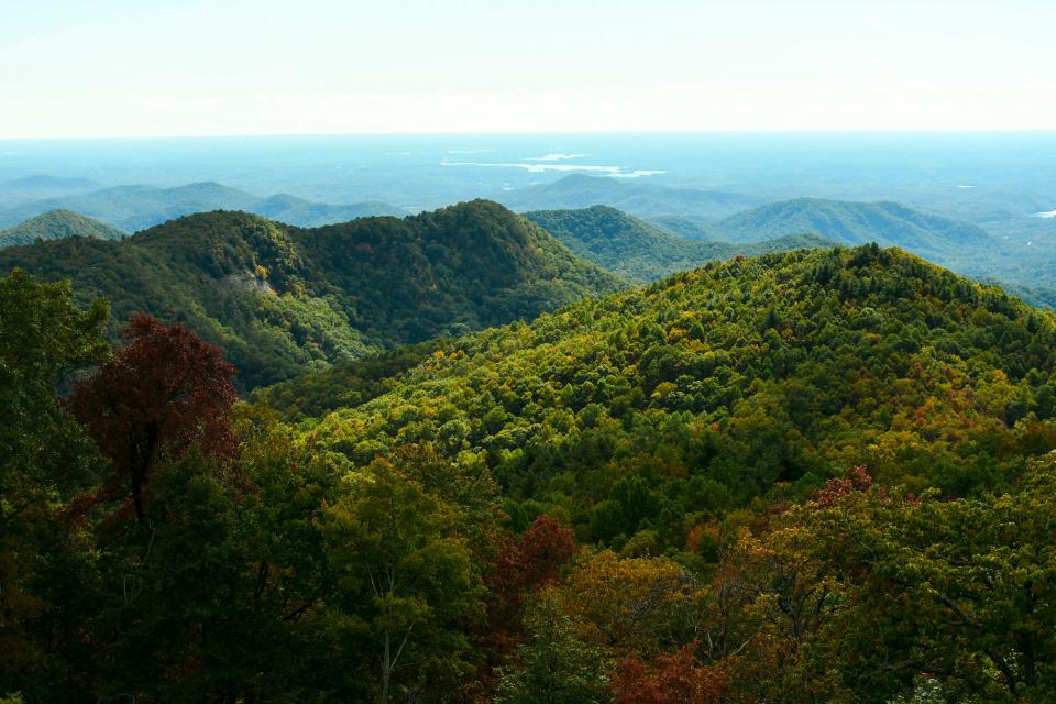 Leaves begin to change in the Blue Ridge Mountains seen from Sassafras Mountain on Tuesday, Oct. 23, 2023.