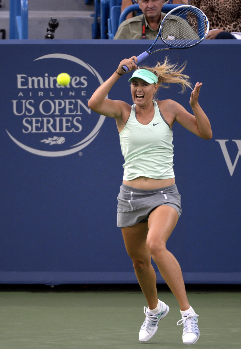 Maria Sharapova, from Russia, hits the ball during a match against Sloane Stephens, from the United States, at the Western & Southern Open tennis tournament, Tuesday, August 13, 2013, in Mason, Ohio. (AP Photo/Michael E. Keating)