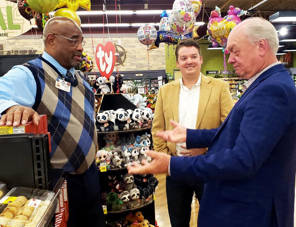 Anderson County Chamber President Rick Meredith, right, speaks with Sam Turner, left, Food City in Clinton's store manager, and Trey McAdams, Chamber Foundation chairman, after the $15,000 check presentation at the Clinton store.