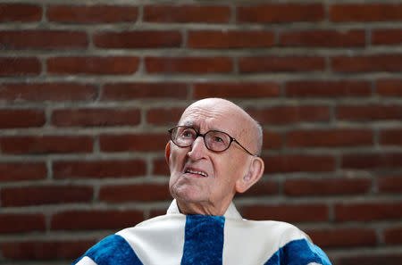 Father Jacques Clemens attends a mass at St. Benoit church in Nalinnes, Belgium, July 10, 2016. REUTERS/Francois Lenoir