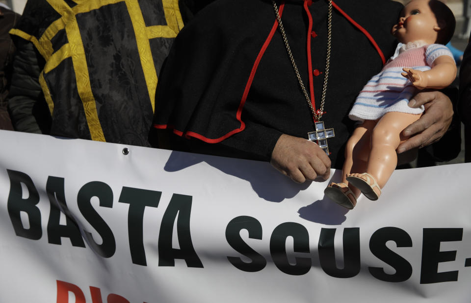 Sex abuse survivors and members of the ECA (Ending Clergy Abuse) march in downtown Rome holding a banner reading "stop excuses", Saturday, Feb. 23, 2019. Pope Francis is hosting a four-day summit on preventing clergy sexual abuse, a high-stakes meeting designed to impress on Catholic bishops around the world that the problem is global and that there are consequences if they cover it up. (AP Photo/Alessandra Tarantino)