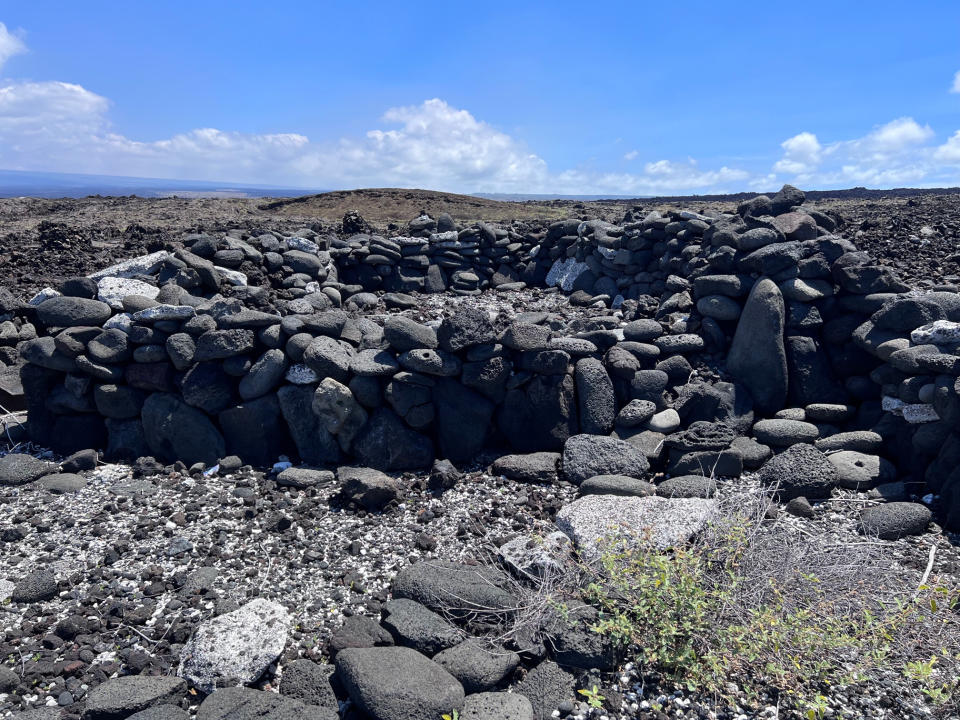 In this undated photo provided by the U.S. National Park Service, stone walls of a former coastal dwelling is shown at Pohue Bay on Hawaii's Big Island. Hawaii Volcanoes National Park on the Big Island on Tuesday, July 12, 2022, was given new land in a deal that will protect and manage an ocean bay area that is home to endangered and endemic species and to rare, culturally significant Native Hawaiian artifacts. (National Park Service via AP)