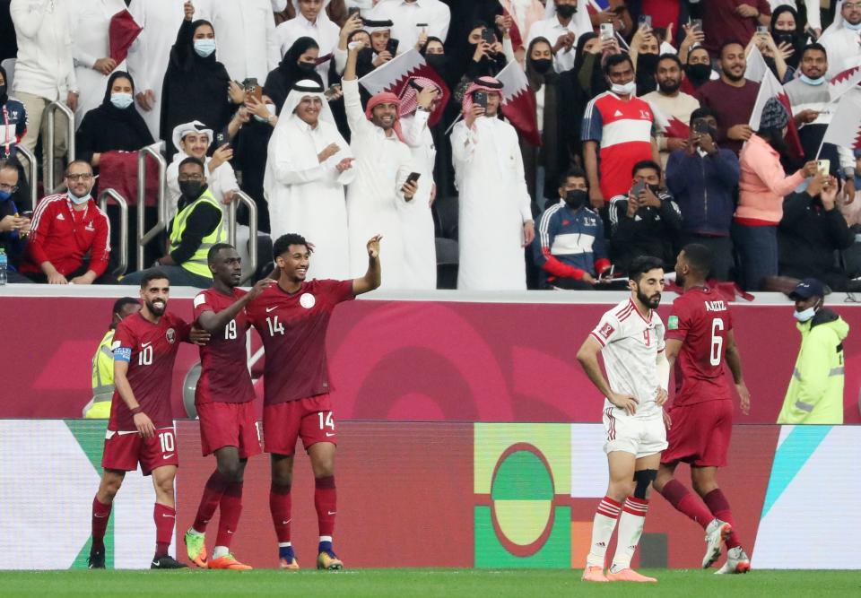 Soccer Football - Arab Cup - Quarter-Final - Qatar v United Arab Emirates - Al Bayt Stadium, Al Khor, Qatar - December 10, 2021 Qatar's Almoez Ali celebrates scoring their fifth goal with teammates REUTERS/Suhaib Salem