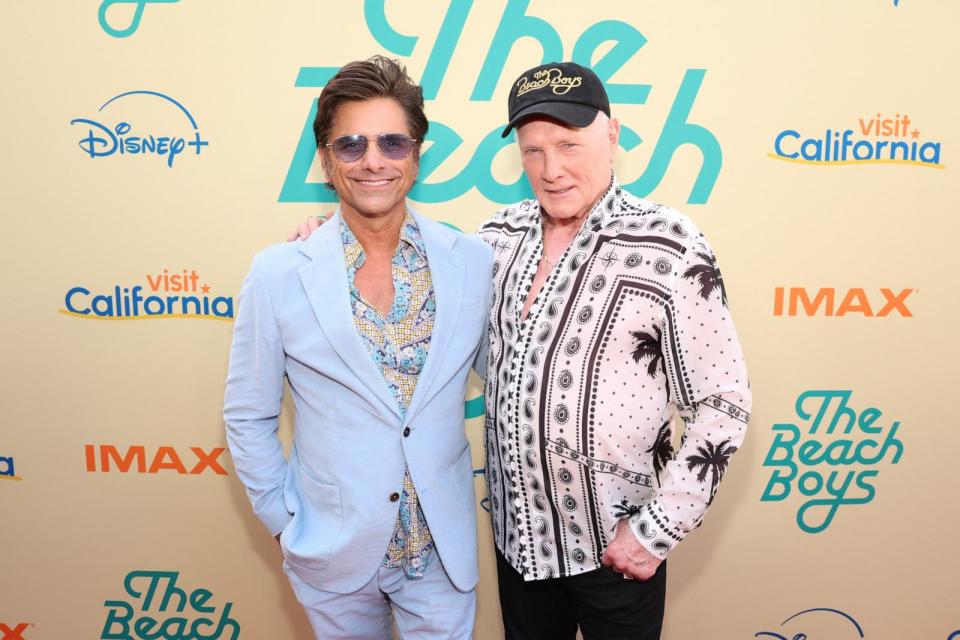 PHOTO: John Stamos, left, and Mike Love attend the world premiere of the Disney+ documentary 'The Beach Boys' at the TLC Chinese Theatre, May 21, 2024, in Hollywood, Calif. (Jesse Grant/Getty Images for Disney)