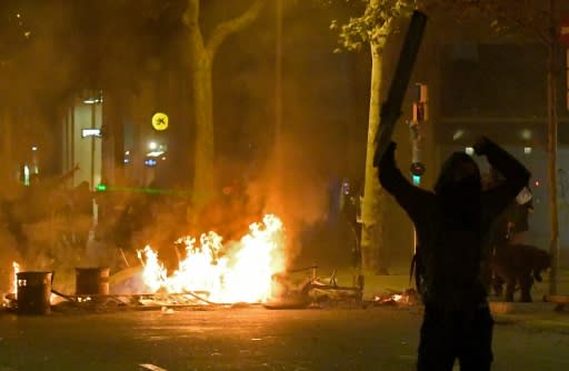 Hundreds of young protesters chanting 'independence' burned barricades in the centre of Barcelona