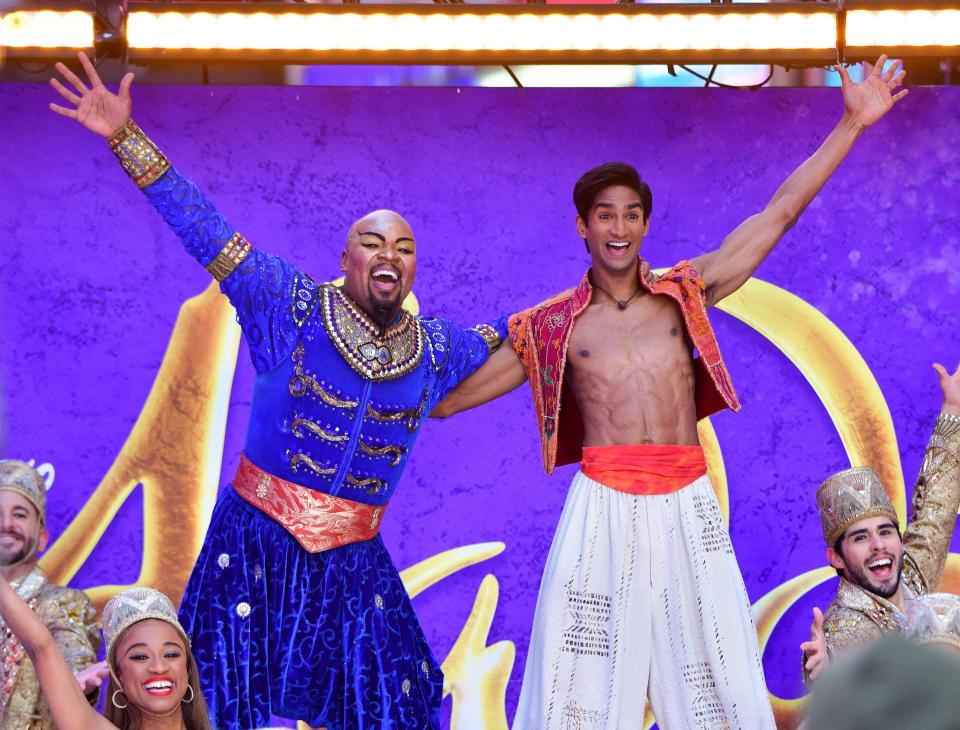 Michael James Scott and Michael Maliakel of Broadway's "Aladdin" perform outside ABC's "Good Morning America" in Times Square on November 24, 2021 in New York City.