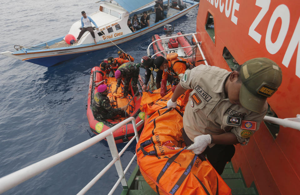 Rescuers load body bags containing debris and remains of the victims of the crashed Lion Air plane. Image: AP