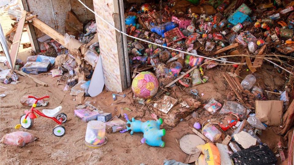 Toys seen in damaged shop