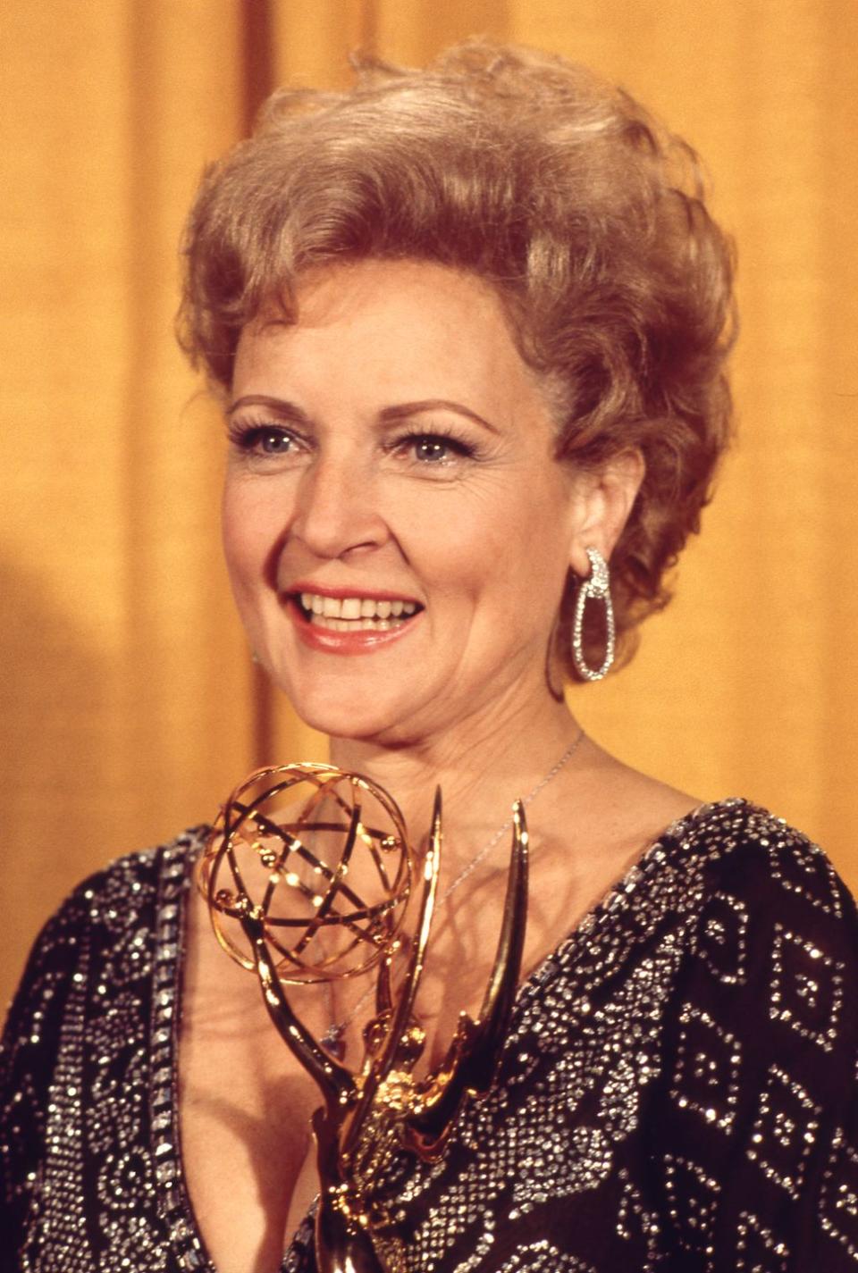 1975: White wins an Emmy Award.