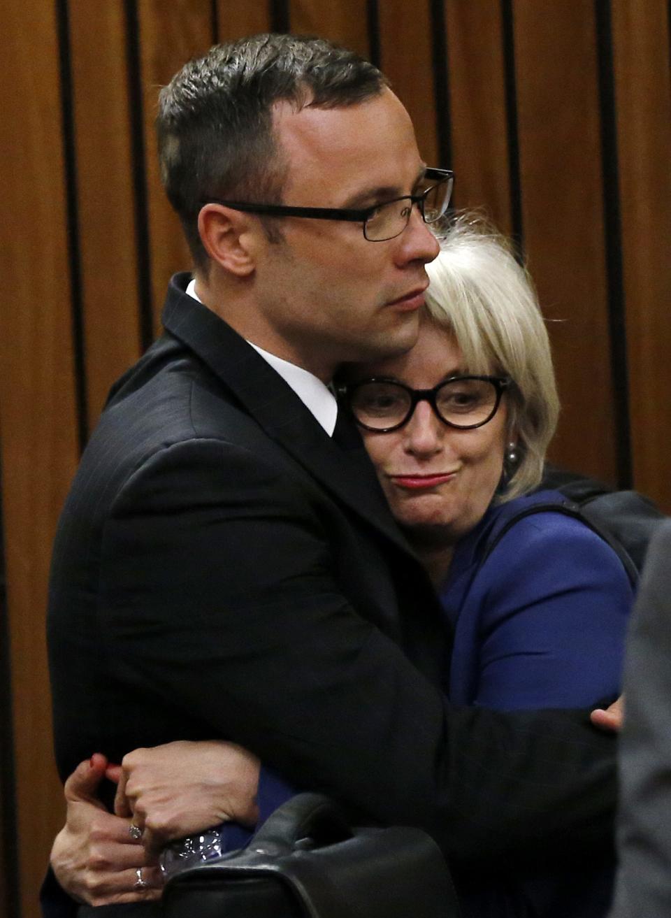 Olympic and Paralympic track star Pistorius hugs his aunt after the end of his trial at the North Gauteng High Court in Pretoria