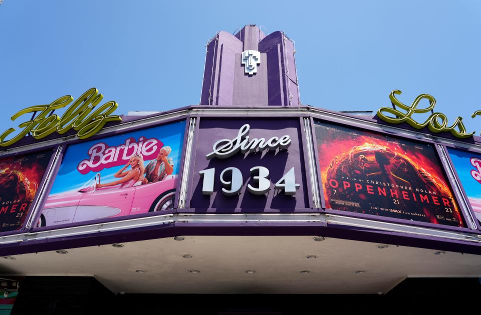 The marquee of the Los Feliz Theatre features the films "Barbie" and "Oppenheimer," Friday, July 28, 2023, in Los Angeles. (AP Photo/Chris Pizzello)