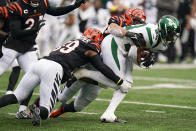 New York Jets running back Breece Hall (20) is tackled by Cincinnati Bengals' Akeem Davis-Gaither (59) during the first half of an NFL football game Sunday, Sept. 25, 2022, in East Rutherford, N.J. (AP Photo/Seth Wenig)