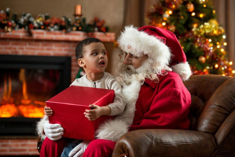 is santa claus real, photo of child on santa's lap