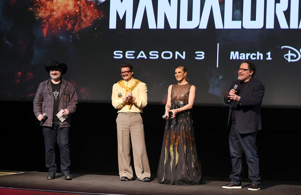 (L-R) Executive Producer Dave Filoni, Pedro Pascal, Katee Sackhoff, and Showrunner/Executive Producer Jon Favreau speak onstage during the Mandalorian special launch event at El Capitan Theatre in Hollywood, California on February 28, 2023.