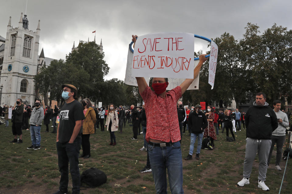 Workers from the event industry protest at Parliament Square in London, Tuesday, Sept. 29, 2020, demanding help for their industry after the shutdown due to the coronavirus outbreak. (AP Photo/Frank Augstein)