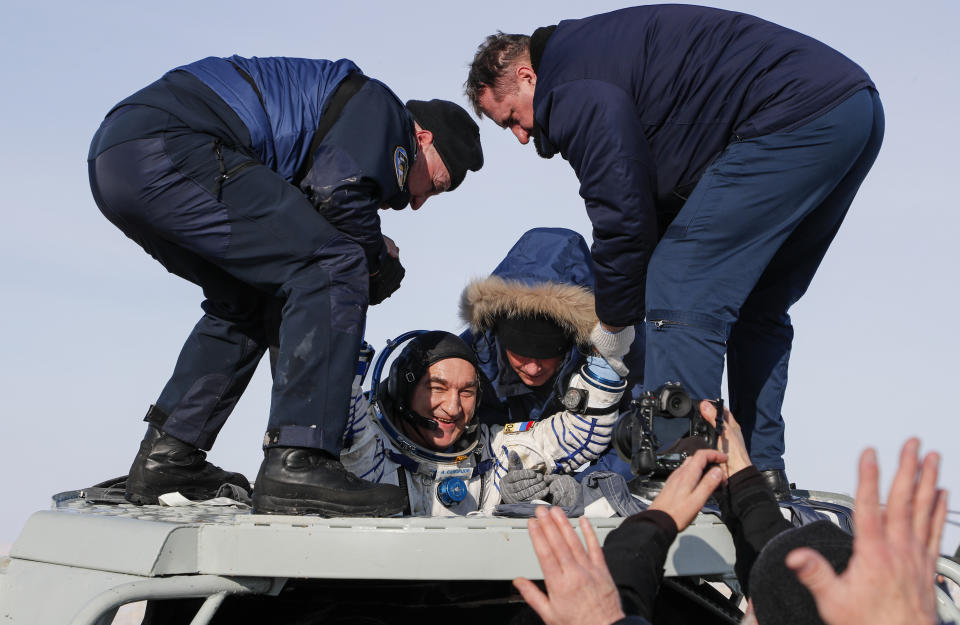 Russian space agency rescue team help Russian cosmonaut Alexander Skvortsov out of the capsule shortly after the landing of the Russian Soyuz MS-13 space capsule about 150 km ( 80 miles) south-east of the Kazakh town of Zhezkazgan, Kazakhstan, Thursday, Feb. 6, 2020. A Soyuz space capsule with U.S. astronaut Christina Koch, Italian astronaut Luca Parmitano and Russian cosmonaut Alexander Skvortsov, returning from a mission to the International Space Station landed safely on Thursday on the steppes of Kazakhstan. (Sergei Ilnitsky/Pool Photo via AP)