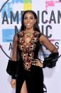 <p>The Voice Australia judge Kelly Rowland went for a rather eccentric look in a velvet black dress with sheer sleeves and a red-patterned plunging neckline.</p>